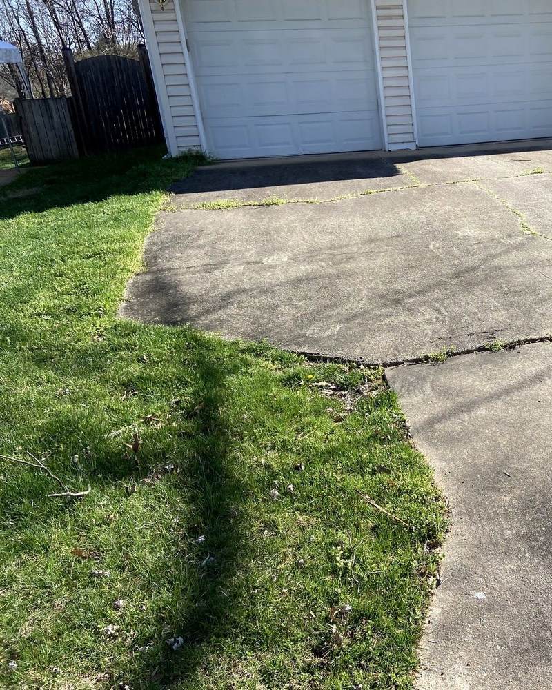 Cracked concrete driveway before replacement in Burke, Virginia
