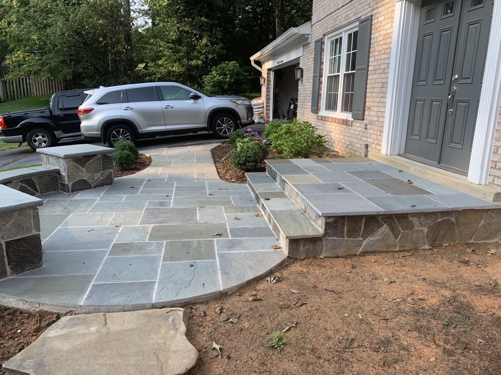 Natural stone hardscape entry and sitting wall